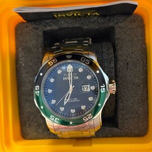 Invicta Silver Watch with Green Accents